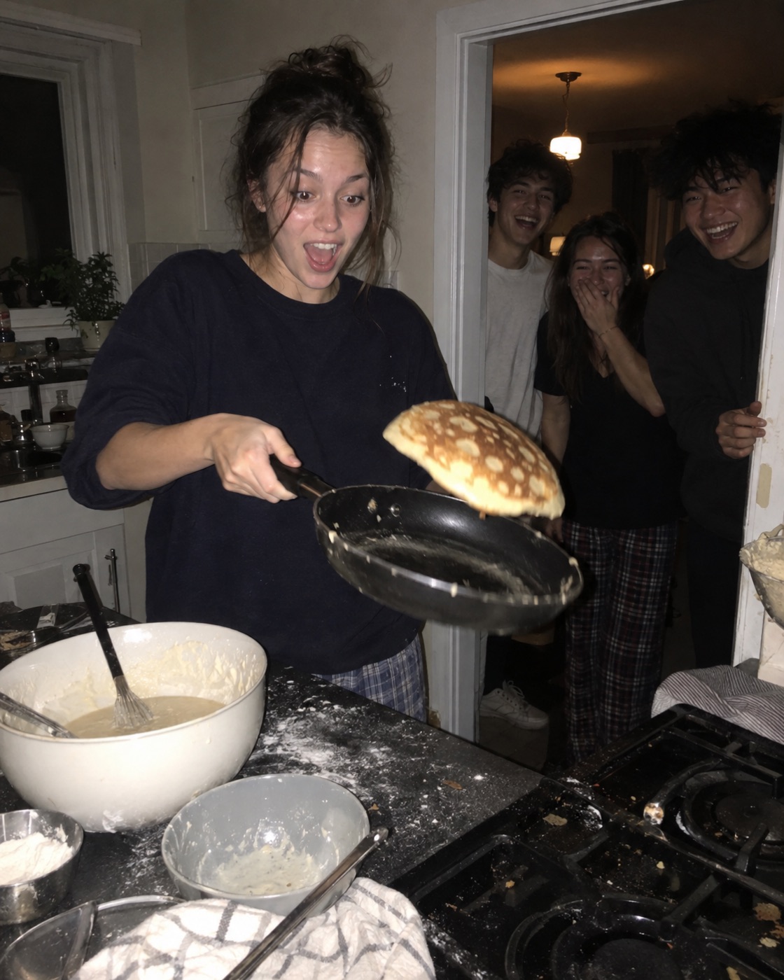 Flipping pancakes in a kitchen at 2am
